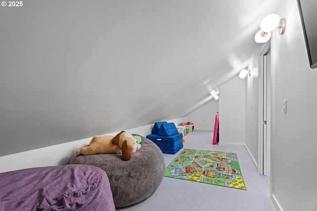 recreation room with lofted ceiling, carpet, and baseboards