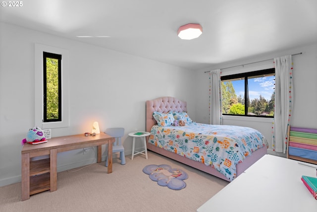 carpeted bedroom featuring multiple windows