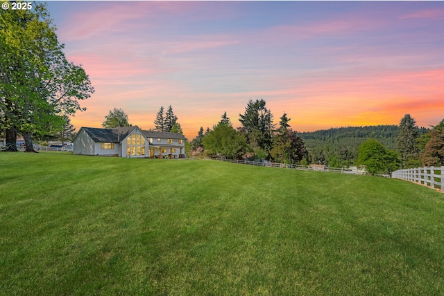 view of yard at dusk