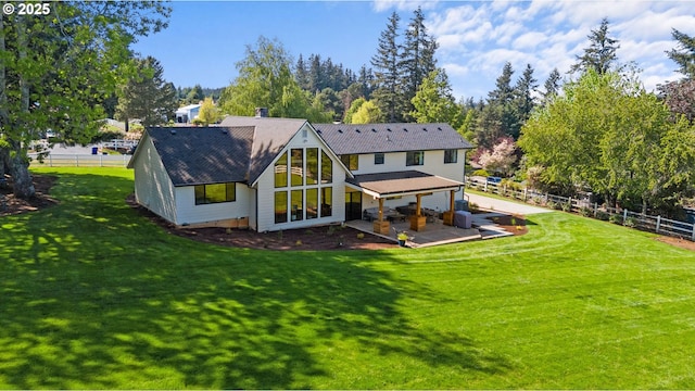 rear view of property featuring a patio area