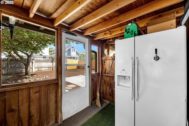 6206 N Denver Ave, Portland, OR 97217 - doorway with dark colored carpet and wooden ceiling with exposed beams