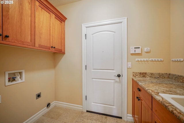 washroom featuring cabinets, hookup for a washing machine, and electric dryer hookup