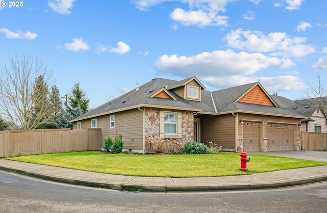 view of front of house featuring a garage and a front lawn