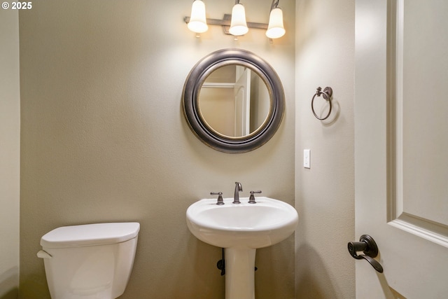 bathroom with sink and toilet