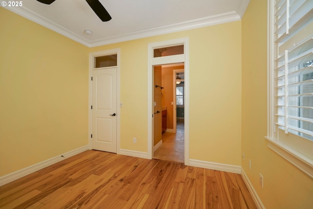 unfurnished bedroom with ceiling fan, ornamental molding, and light hardwood / wood-style flooring