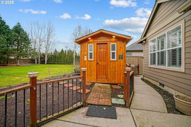 view of outbuilding featuring a lawn