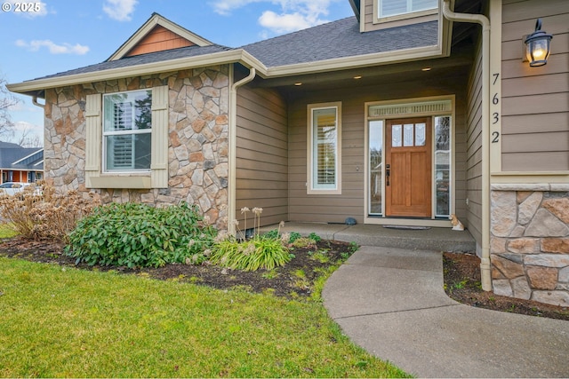 property entrance with a yard