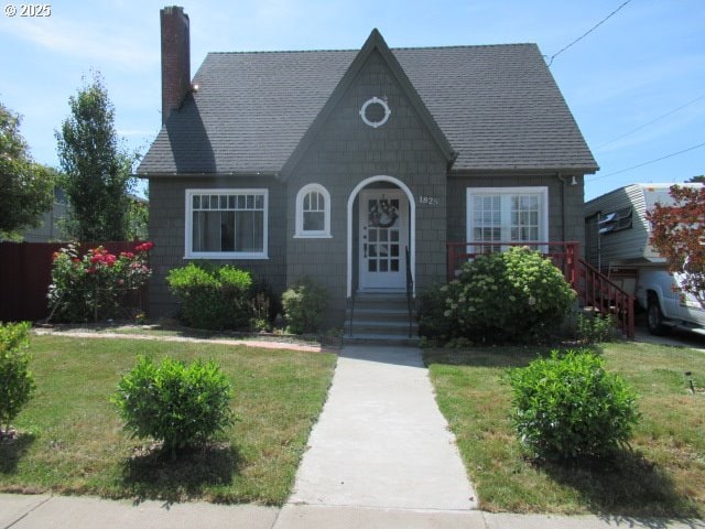 1825 NE 4th St, Salem, OR 97301 - view of front of home featuring a chimney, a front lawn, and a shingled roof