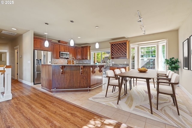 1748 Hardin Ave NW, Salem, OR 97304 - dining space featuring baseboards, recessed lighting, light tile patterned floors, and track lighting