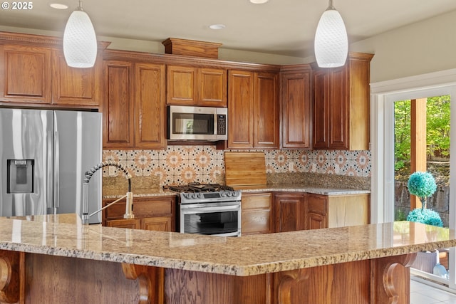 1748 Hardin Ave NW, Salem, OR 97304 - kitchen featuring stainless steel appliances, brown cabinets, decorative backsplash, light stone countertops, and a kitchen bar