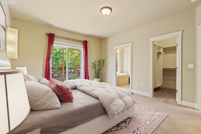1748 Hardin Ave NW, Salem, OR 97304 - carpeted bedroom featuring a walk in closet, connected bathroom, and baseboards