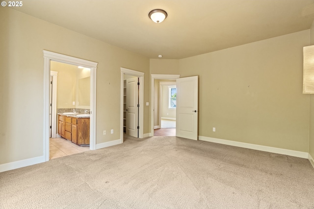 1748 Hardin Ave NW, Salem, OR 97304 - unfurnished bedroom with light carpet, a spacious closet, baseboards, a closet, and connected bathroom