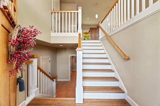 1748 Hardin Ave NW, Salem, OR 97304 - staircase featuring wood finished floors, a towering ceiling, and baseboards