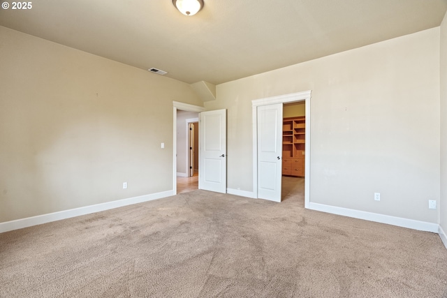 1748 Hardin Ave NW, Salem, OR 97304 - unfurnished bedroom featuring light carpet, baseboards, a walk in closet, and a closet