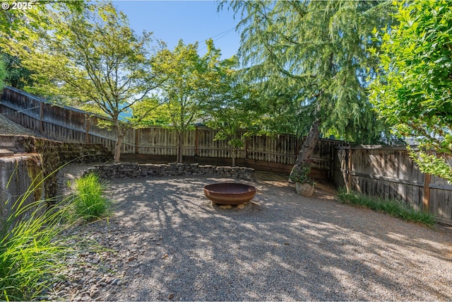 1748 Hardin Ave NW, Salem, OR 97304 - fenced backyard featuring an outdoor fire pit