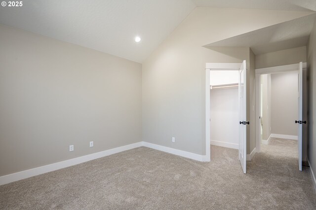 24934 Westfield Ave, Veneta, OR 97487 - unfurnished bedroom with vaulted ceiling, carpet flooring, recessed lighting, a spacious closet, and a closet