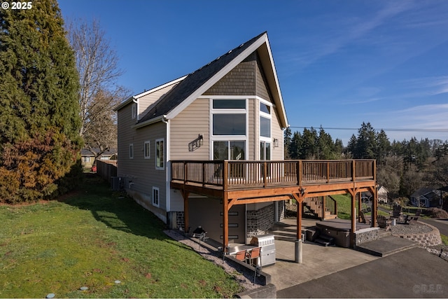 view of front of home with a deck, a patio, central AC, stairs, and a front lawn