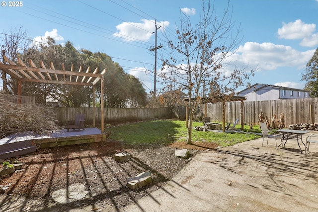 view of yard with a patio area, a fenced backyard, and a pergola