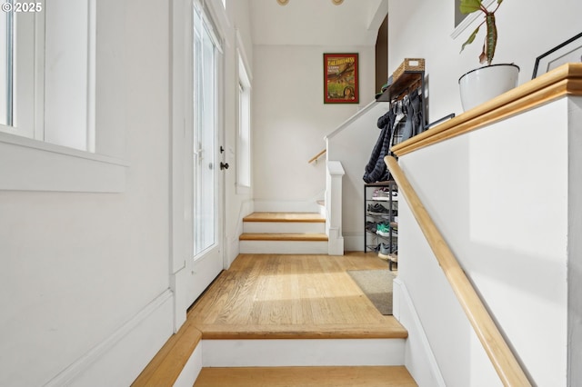 foyer with stairway and wood finished floors