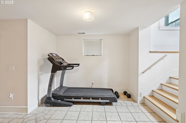 workout area with visible vents and baseboards