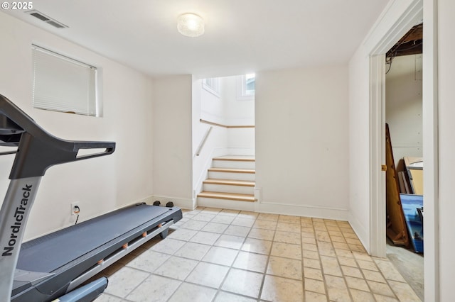 exercise area with visible vents and baseboards