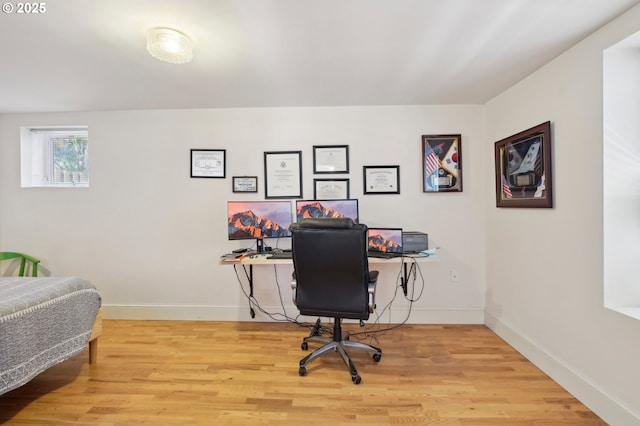 office featuring light wood-type flooring and baseboards