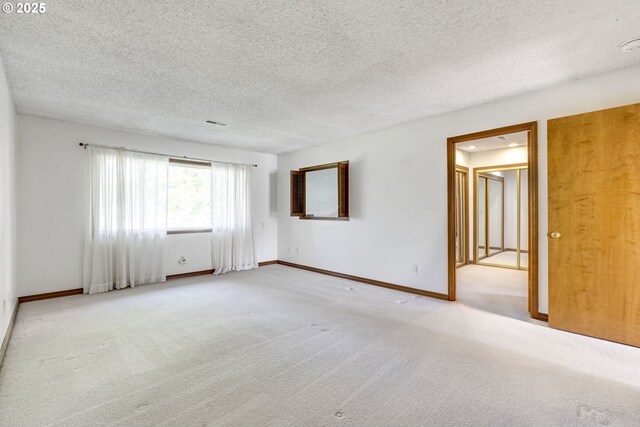 7430 SW Greens View Ct, Wilsonville, OR 97070 - hallway featuring a textured ceiling, tile patterned floors, and carpet floors