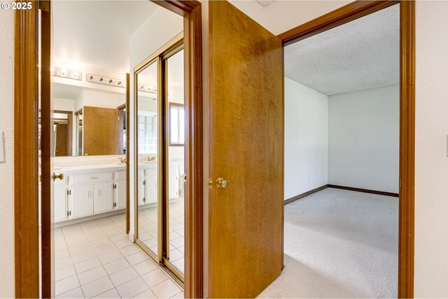 7430 SW Greens View Ct, Wilsonville, OR 97070 - bathroom with double vanity and tile patterned floors