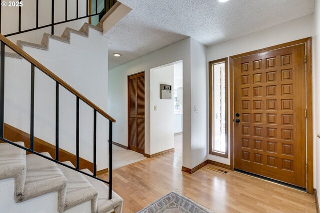 7430 SW Greens View Ct, Wilsonville, OR 97070 - unfurnished living room with carpet, healthy amount of natural light, lofted ceiling, a brick fireplace, and baseboards