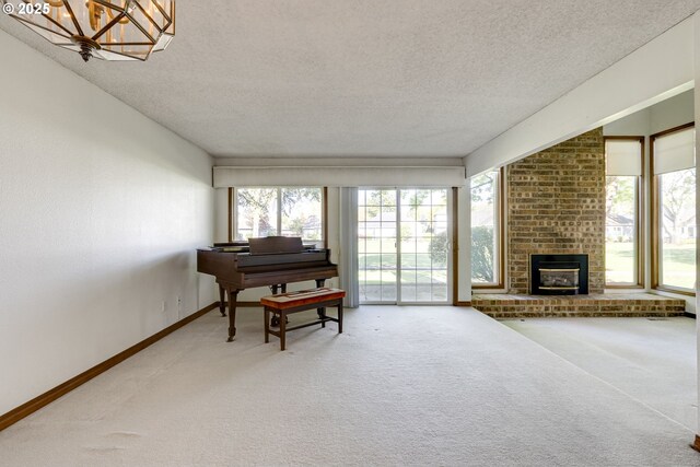 7430 SW Greens View Ct, Wilsonville, OR 97070 - sitting room featuring light carpet, healthy amount of natural light, a textured ceiling, and baseboards