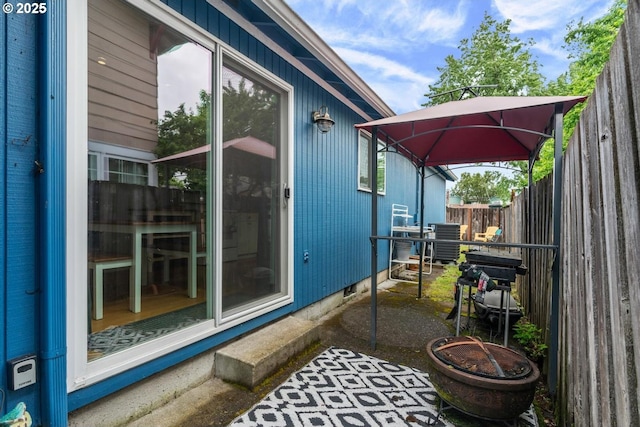 view of patio with central AC unit and a gazebo