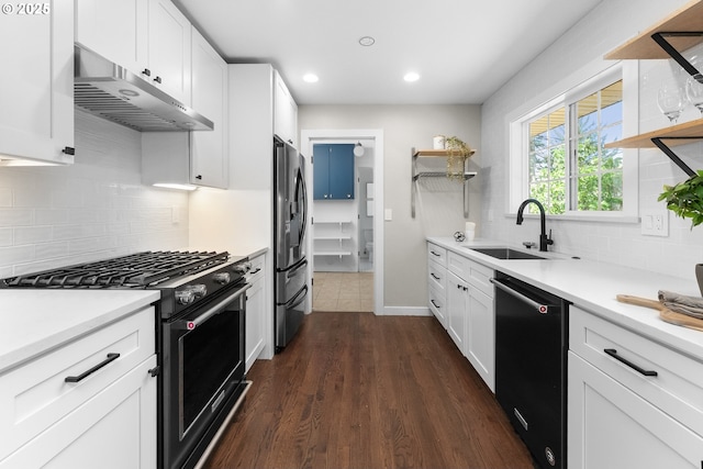 14255 NE Brazee St, Portland, OR 97230 - kitchen featuring stainless steel appliances, under cabinet range hood, open shelves, dark wood finished floors, and recessed lighting
