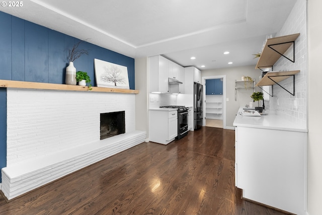 14255 NE Brazee St, Portland, OR 97230 - kitchen featuring appliances with stainless steel finishes, open shelves, under cabinet range hood, light countertops, and recessed lighting