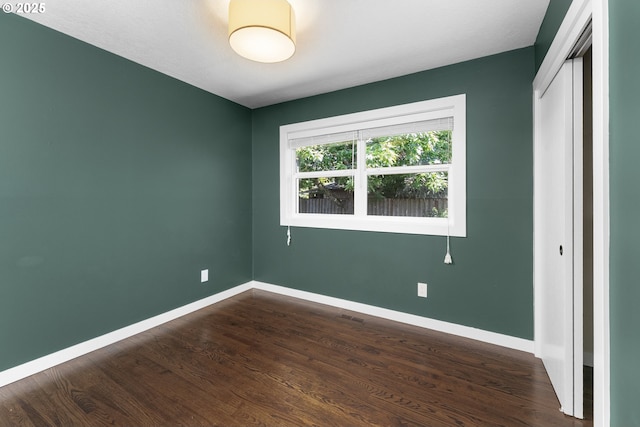 14255 NE Brazee St, Portland, OR 97230 - unfurnished bedroom with dark wood-style flooring and a closet