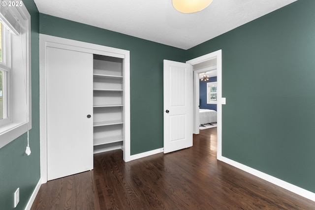 14255 NE Brazee St, Portland, OR 97230 - unfurnished bedroom featuring wood finished floors and a closet