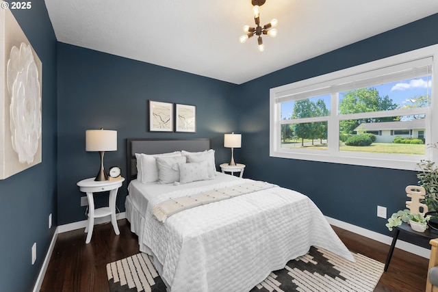 14255 NE Brazee St, Portland, OR 97230 - bedroom with a chandelier and wood finished floors