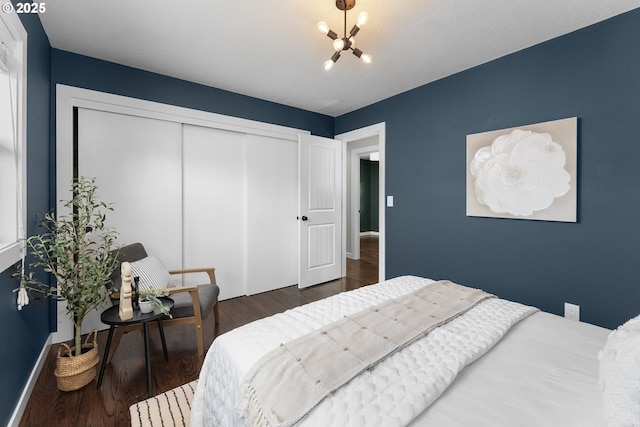 14255 NE Brazee St, Portland, OR 97230 - bedroom featuring a chandelier, a closet, and wood finished floors