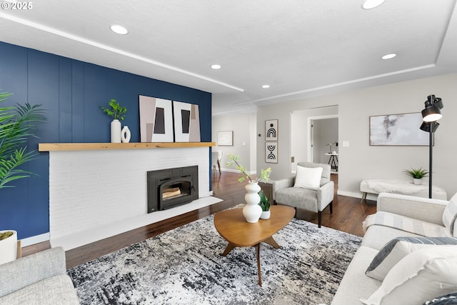 14255 NE Brazee St, Portland, OR 97230 - living area with wood finished floors, a fireplace, and recessed lighting