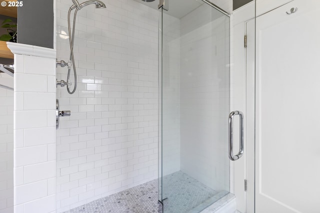 full bath with a shower stall