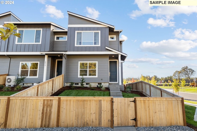 view of front of home featuring ac unit