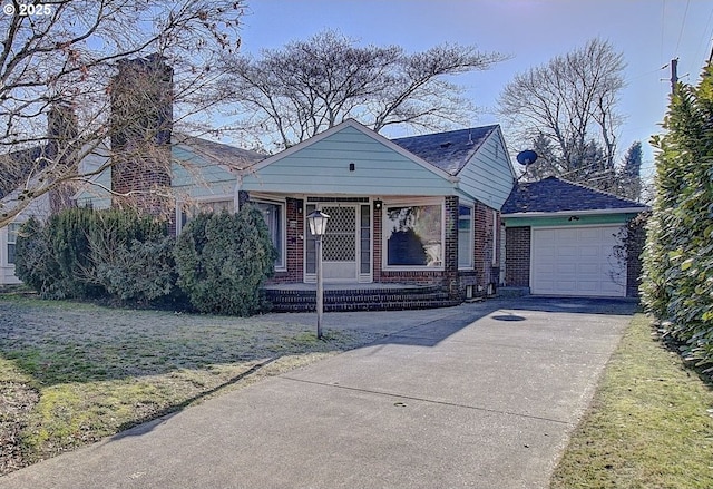 bungalow-style home with a garage, covered porch, and a front lawn