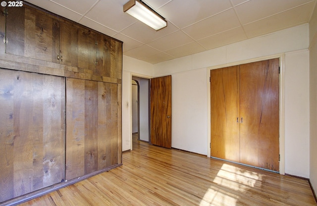 unfurnished bedroom featuring light wood-type flooring