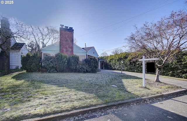 view of property exterior featuring a lawn