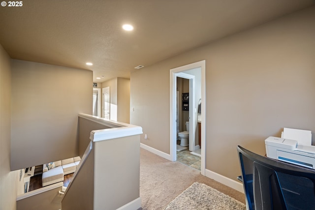 bedroom featuring a ceiling fan, baseboards, a raised ceiling, and carpet flooring