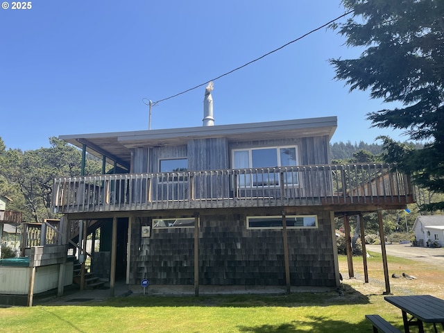5870 Floyd Ave, Cloverdale, OR 97112 - back of property with a deck, stairs, and a lawn
