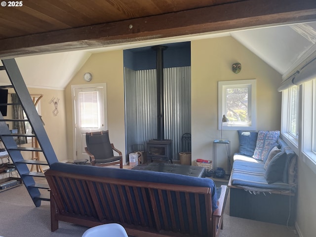 5870 Floyd Ave, Cloverdale, OR 97112 - carpeted living room with stairs, a wood stove, plenty of natural light, and vaulted ceiling with beams