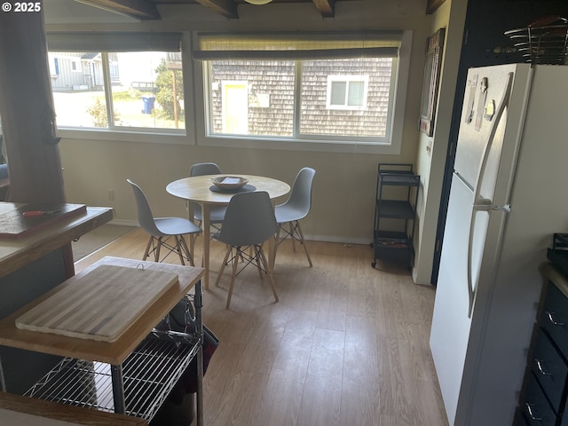5870 Floyd Ave, Cloverdale, OR 97112 - dining room featuring baseboards and light wood-type flooring