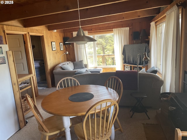 5870 Floyd Ave, Cloverdale, OR 97112 - carpeted dining room with wood walls and beam ceiling