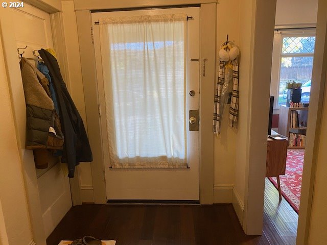 doorway featuring dark hardwood / wood-style floors