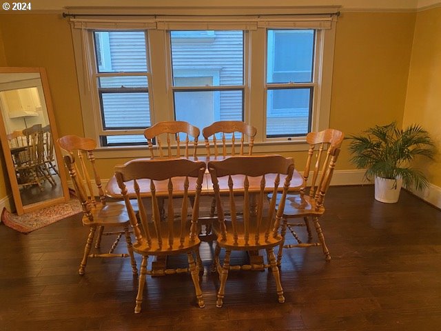 dining area with dark hardwood / wood-style floors